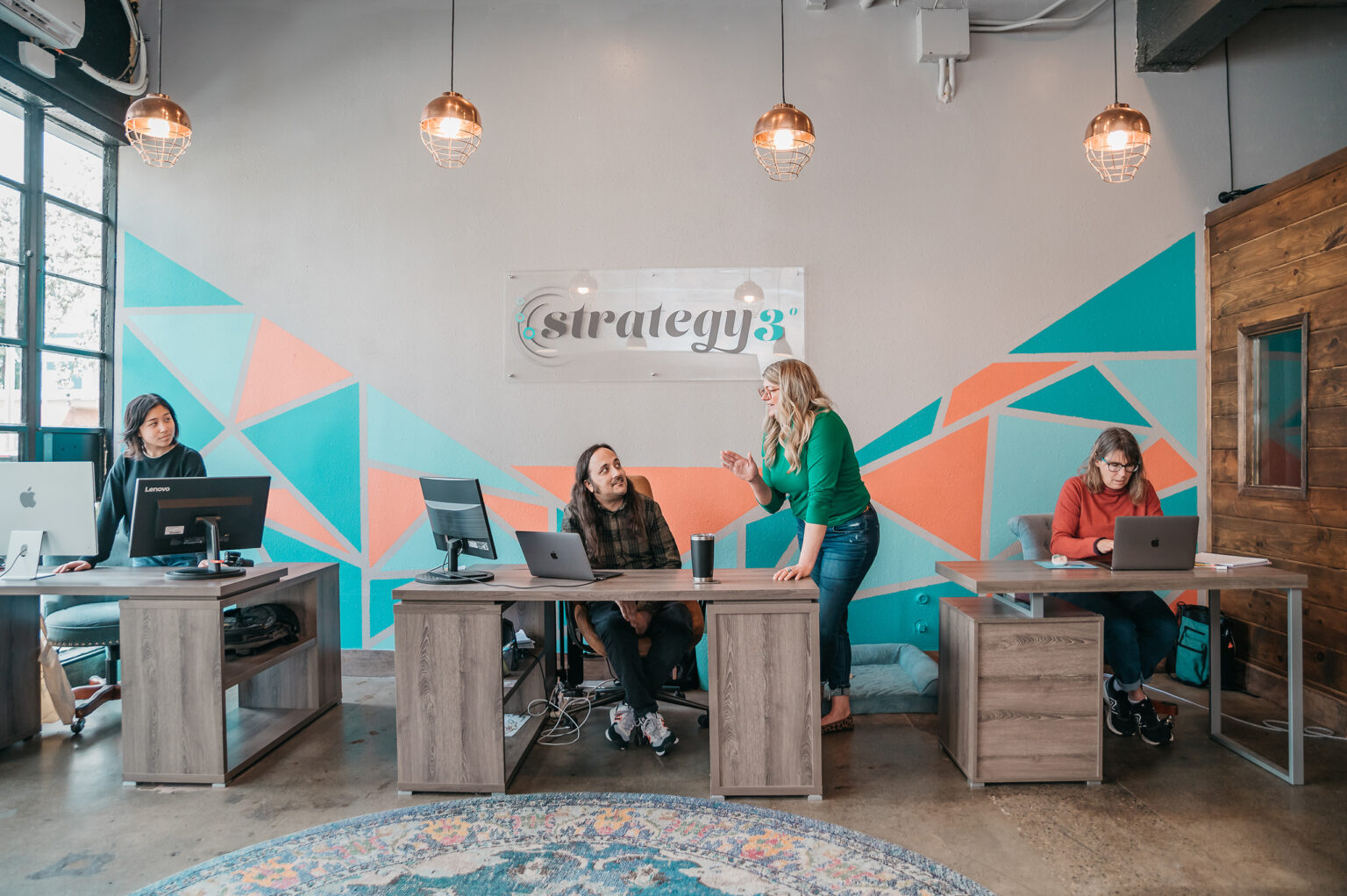 The Strategy 3 team at work in the Tacoma office